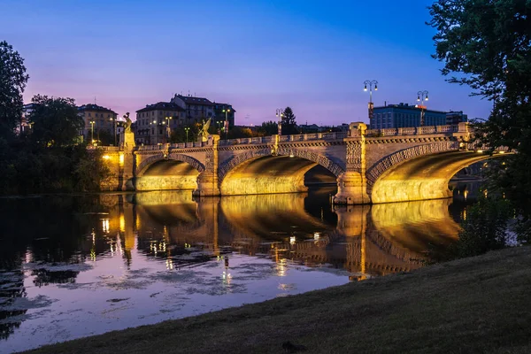 Beautiful night view of the bridge over the river Po in the city of Turin, Italy.