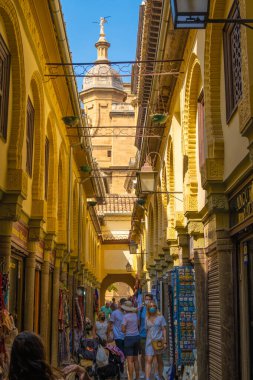 GRANADA, SPAIN - SEPTEMBER 25, 2021: Tourists at the old Alcaiceria arab market.