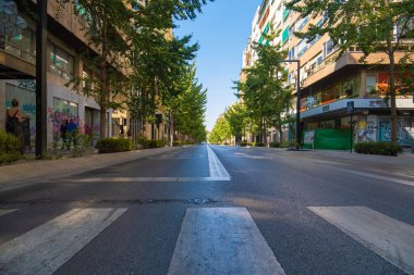 GRANADA, SPAIN - SEPTEMBER 25, 2021: Beautiful view of the main avenue of the city of Granada Gran Va de Coln