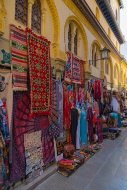 GRANADA, SPAIN - SEPTEMBER 25, 2021: Tourists at the old Alcaiceria arab market.