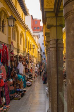 GRANADA, SPAIN - SEPTEMBER 25, 2021: Tourists at the old Alcaiceria arab market.
