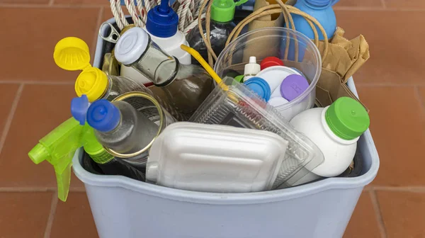 Home Recycling Bin with lid before sorting glass, plastic, paper, metal into separate recycling containers. Isolated on a brown background. Close-up.Copy space.  Garbage recycling concept.