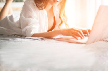 Sexy women reading message on laptop
