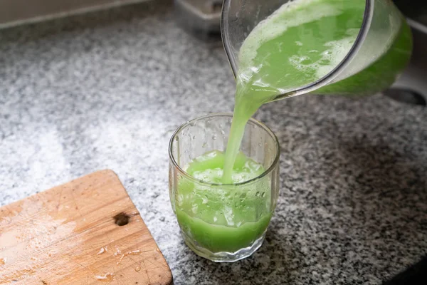 Pouring Healthy Green Juice Glass — Stock Photo, Image