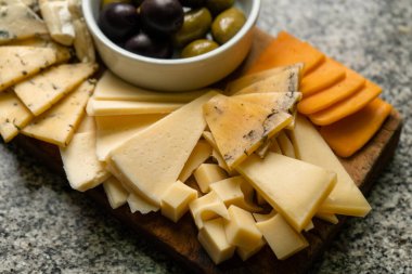 Cheese board with a variety of flavors. Close-up.