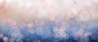 Mavi arka planda ton ışıkları olan soyut, bulanık pembe daire