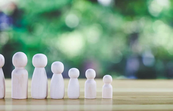 Wooden figures of people on Wooden table.Personal selectio