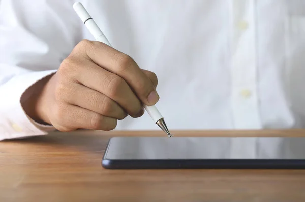 close up hand using pen tablet.Saving plan concept.