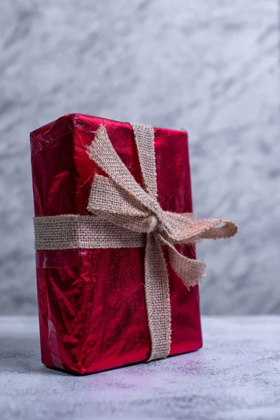 Gift Box Wrapped Red Paper Concrete Table — Stock Photo, Image