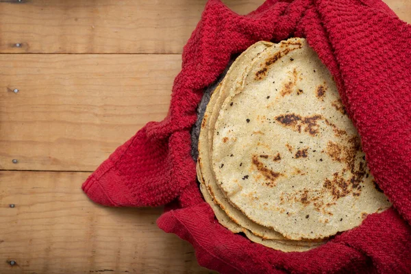 Corn Tortillas Wrapped Red Cloth Wooden Table Typical Mexican Food — Stok fotoğraf
