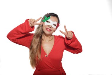 Mexican woman wearing tricolor mask. Mexican woman wearing red dress and mask with colors of the Mexican flag. White background.