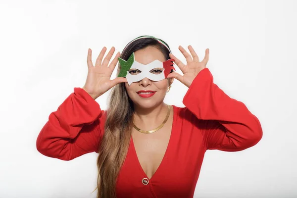 Mexican woman wearing tricolor mask. Mexican woman wearing red dress and mask with colors of the Mexican flag. White background.