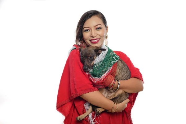 Woman carrying her dog. Mexican woman carrying her dog wrapped in a Mexican flag colors scarf. white background.