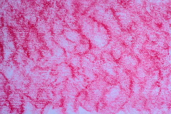Textured paper painted with fuchsia colored chalk.