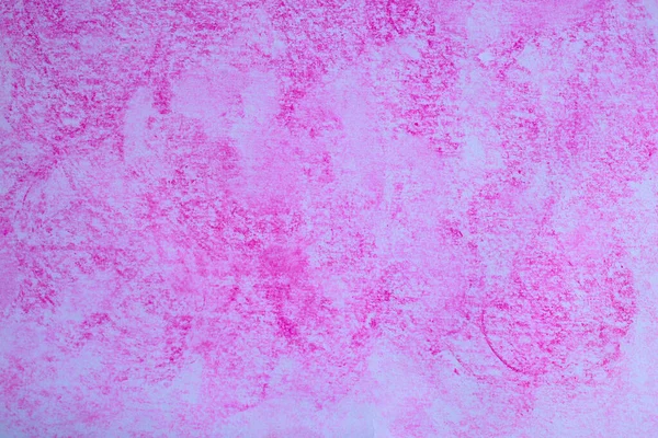 Textured paper painted with fuchsia colored chalk.
