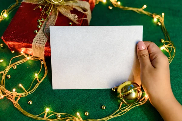 Blank card with Christmas decorations. Christmas card mockup.