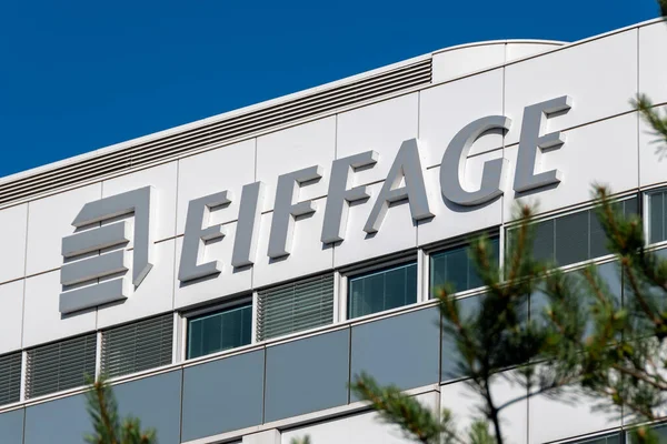 stock image Velizy-Villacoublay, France - June 12, 2022: Sign and logo on top of the headquarters building of Eiffage, an international French group specializing in construction and public works