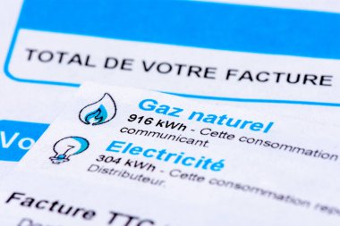 Rise of energy prices in France: close-up of a French invoice with details of the natural gas and electricity consumptions to be paid measured in kWh
