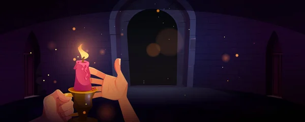 Рука тримає свічку в темному підземеллі вночі — стоковий вектор