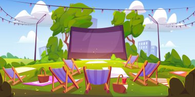 Open air cinema on green lawn in city park
