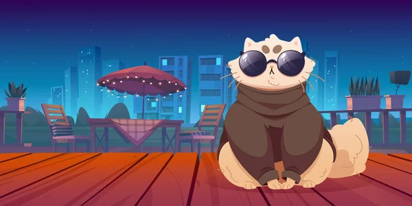 Cute cat sitting on wooden terrace with night view. Funny pet wear trendy clothes and glasses on patio area with table and chairs under umbrella on cityscape background, Cartoon vector illustration