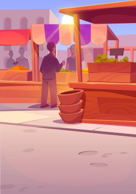 Dışarıdaki tezgahlardan ürün alan insanların olduğu bir doğu pazarı. Tedarikçiler, çizgili tenteli ahşap panayır kabinlerinde ziyaretçilere baharat, çanak çömlek ve diğer ürünler sunuyor.