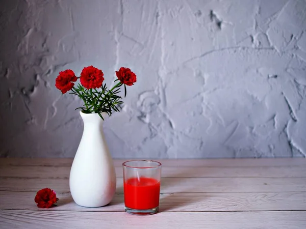 Red flowers in vase on table still life flowers for background or wallpaper ,red moss rose purslane portulaca grandiflora ,text message writing ,Valentine\'s day ,love card design ,romantic lovely