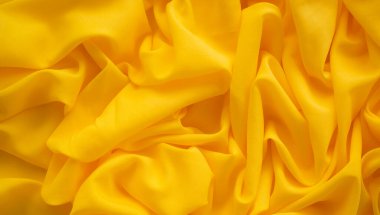 Sarı Renkli Kumaş Arkaplanı. Kalıp Yüzey Doku Malzemesi Pamuk Kumaş Arkaplanı. Işık Parıltısı. Lüks tasarım Sanatsal Dekorasyon Çorap Kumaşı Doğal. Boş alanı olan düz uzandı.