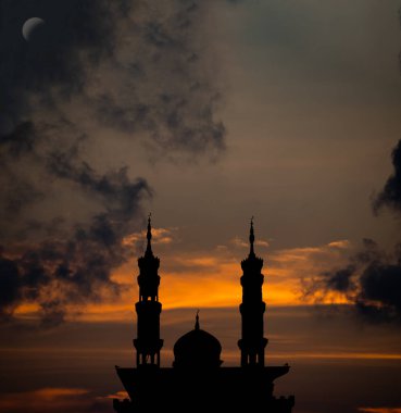 Ramadan, Eid ai-fitr,New year Muharram islamic religion Symbols with Mosques Dome silhouette with Crescent moon on dark black and twilight sky in night sunset. arabic,Eid al-adha,mubarak  Muslim.