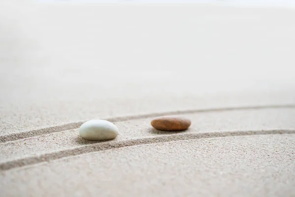 Japanese Zen Garden with Pebble with Line on Sand.mini Stone on Beach backgrond Top View and nobody.Ciircle Rock Balance Japan on nature.Simplicity Purity life.Relax Aromatherapy Spa and Yoga.Buddhism