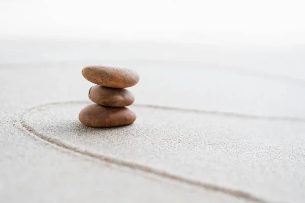 Japanese Zen Garden with Pebble with Line on Sand.mini Stone on Beach backgrond Top View and nobody.Ciircle Rock Balance Japan on nature.Simplicity Purity life.Relax Aromatherapy Spa and Yoga.Buddhism