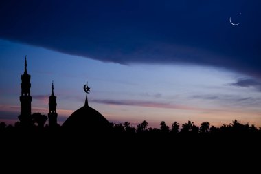 Ramadan,Eid ai-fitr,New year Muharram islamic religion Symbols with Mosques Dome silhouette with Crescent moon on dark black and twilight sky in night sunset,arabic,Eid al-adha,mubarak  Muslim concept
