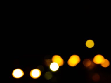 Night Bokeh dark Black Background,Abstract Orange Yellow Colorful Circle Effect Sparkle Blurry Backdrop,for Invitation Special Gala,Birthday Card,Christmas Holidays Celebration,Happy New Year 2023.