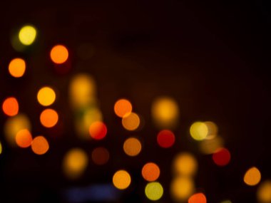 Light Night Bokeh dark Black Background,Abstract Orange Red Colorful Circle Effect Sparkle Blurry Backdrop,for Invitation Special Gala,Birthday Card,Christmas Holidays Celebration,Happy New Year 2023.