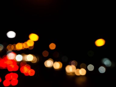 Light Night Bokeh dark Black Background,Abstract Orange Red Colorful Circle Effect Sparkle Blurry Backdrop,for Invitation Special Gala,Birthday Card,Christmas Holidays Celebration,Happy New Year 2023.