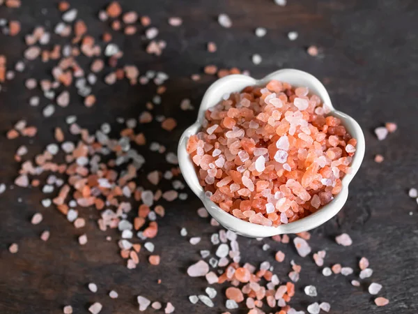 Himalaya Salt in Cup on Wooden Background,Pink Salt Raw Food,