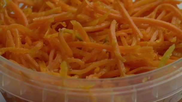 Chopped spicy carrots or pickled carrot rotate in bowl, healthy eating and healthy lifestyle — Stock Video