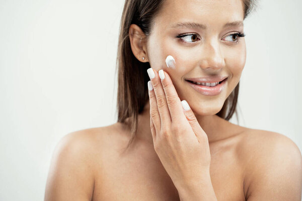 close portrait in the photo Studio. beauty cream face care cosme