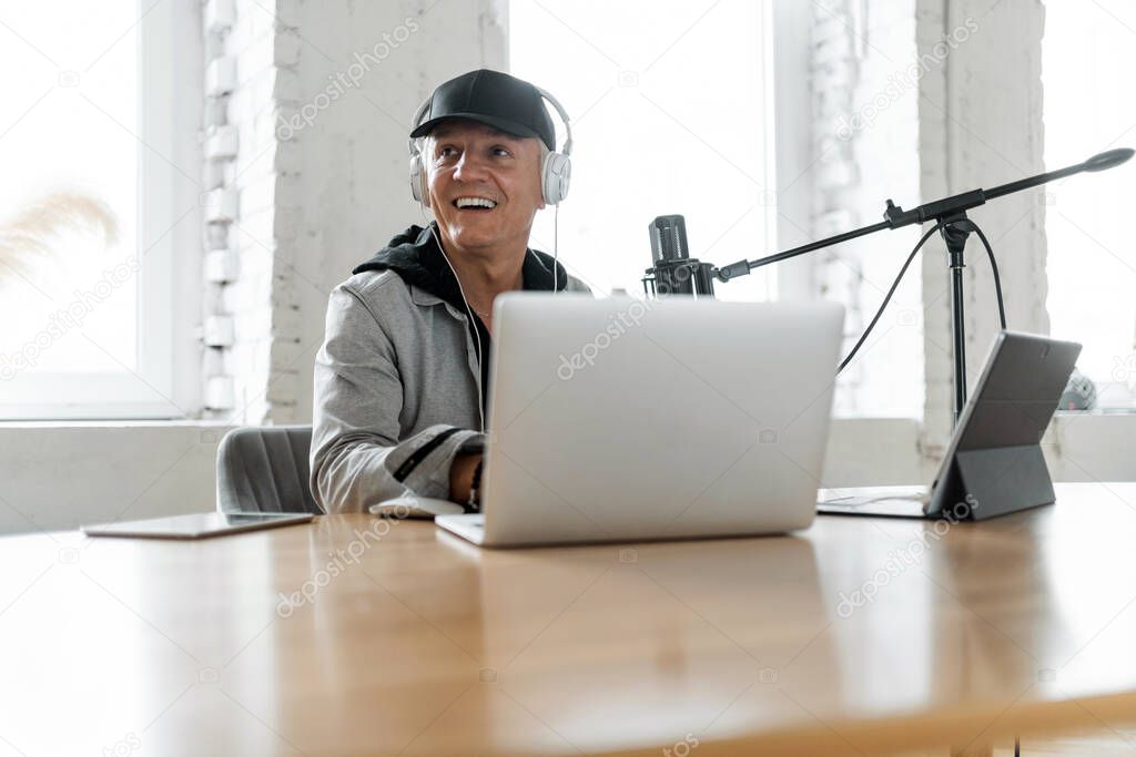 Journalist and interview. A blogger on the radio communicates with listeners. Radio host good news. The speaker speaks into the microphone. Live broadcast recording of the podcast show.