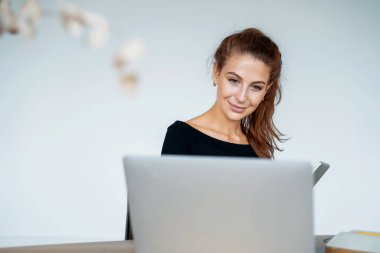 A female student is studying online in a college class. The entrepreneur corresponds with the client by e-mail. A freelancer keeps a blog on a social network on a gadget. clipart