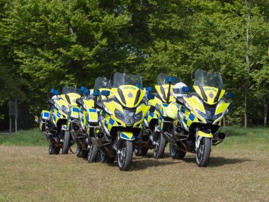 A number of police motorbikes have been parked in formation.Avon and Somerset Constabulary.