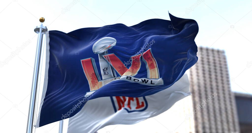 Inglewood, CA, USA, January 2022: The flag with the LVI Super Bowl logo waving in the wind with the NFL flag blurred in the background. The game is scheduled to take place on February 13, 2022