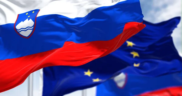 Detail National Flag Slovenia Waving Wind Blurred European Union Flag — Φωτογραφία Αρχείου