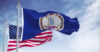The Virginia state flag waving along with the national flag of the United States of America. Virginia is a state in the Mid-Atlantic and Southeastern regions of the United States