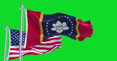 Mississippi eyalet bayrağı, Amerika Birleşik Devletleri bayrağıyla birlikte yeşil bir arka planda dalgalanıyor. Mississippi, ABD 'nin güneydoğu bölgesinde bir eyalettir.. 