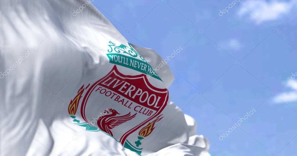 Liverpool, UK, May 2022: The flag of Liverpool Football Club waving in the wind on a clear day. Liverpool F.C. is a professional football club based in Liverpool, England