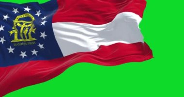 Rüzgarda dalgalanan Gürcistan bayrağı yeşil bir zeminde izole edilmiş. Gürcistan, ABD 'nin güneydoğu bölgesinde bir eyalettir. Demokrasi ve bağımsızlık. Yavaş çekimde kusursuz döngü