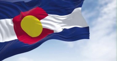the flag of the US state of Colorado waving in the wind. Colorado is a state in the Mountain West subregion of the Western United States. Seamless loop in slow motion