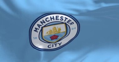 Manchester, UK, May 2022: Fabric background with the Manchester City Flag waving. Manchester F.C. is a professional football club based in Bradford, Manchester. Seamless loop in slow motion