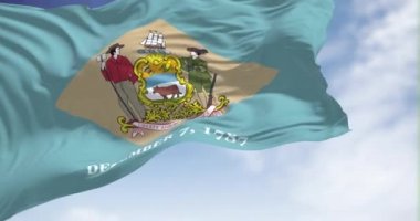 The state flag of Delaware waving in the wind on a clear day. Delaware is a state in the Mid-Atlantic region of the United States. Democracy and independence. Seamless loop in slow motion
